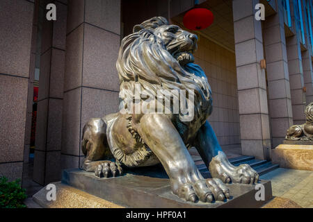 SHENZEN, CHINA - 29 JANUARY, 2017: Inner city streets and sorroundings, statue of lion with great posture. Stock Photo