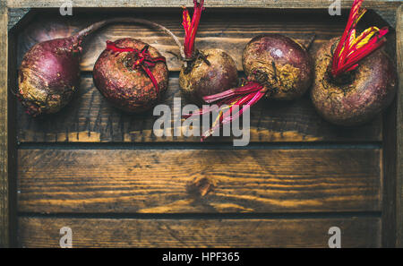 Raw organic purple beetroots in rustic wooden box, selective fovus, top view, copy space Stock Photo