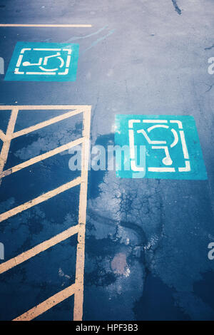 Disabled parking road signs, color toned conceptual picture. Stock Photo