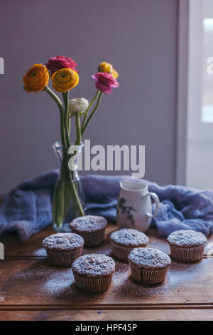 Apple and carrot muffins on a wooden table Stock Photo
