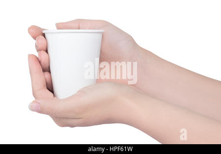 Hands holding white paper cup isolated on white background. Female hands with disposable cup over white background. Breakfast and coffee theme Stock Photo