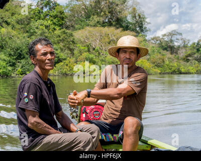 Jangle, Brazil - May 7, 2016: Locals  leading  the small boat on the Amazon river Stock Photo