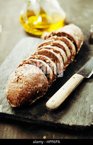 Sliced rye bread on cutting board closeup Stock Photo
