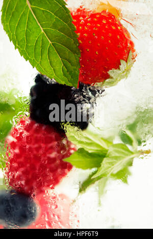 Fruits in the water.  Detox fruit infused flavored water. Refreshing summer homemade cocktail Stock Photo