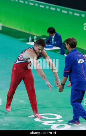 Rio de Janeiro, Brazil. 08 August 2016 Christopher Brooks (USA) after performing on the Parallel Bar during Men's artistic team Stock Photo