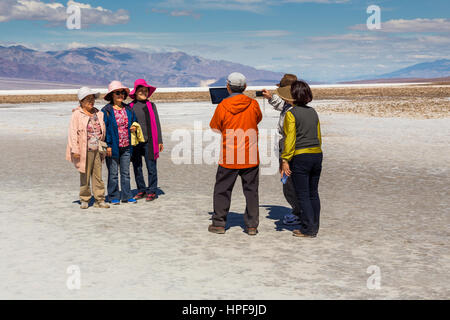 Korean-Americans, people, tourists, visitors, visiting, Badwater Basin, 282 feet below sea level, Death Valley National Park, Death Valley, California Stock Photo