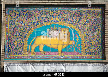 Persian national symbol, sun over lion with sword, glazed tiles, Golestan Palace, Teheran, Iran Stock Photo