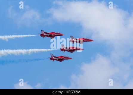 DAWLISH, UNITED KINGDOM - AUGUST 23 2014: The Royal Air Force Red Arrows aerobatics display team flying at the Dawlish Airshow Stock Photo