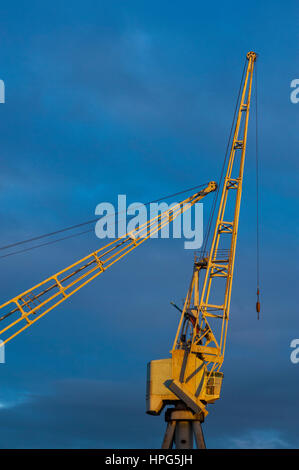 Jips of cranes at Pier at Gravesend Kent. with dramatic sky behind Stock Photo