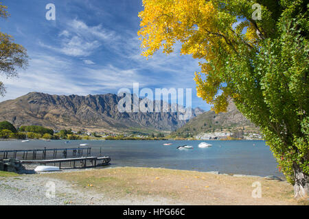 Queenstown, Otago, New Zealand. View to the Remarkables across Frankton Arm, an inlet of Lake Wakatipu, autumn. Stock Photo