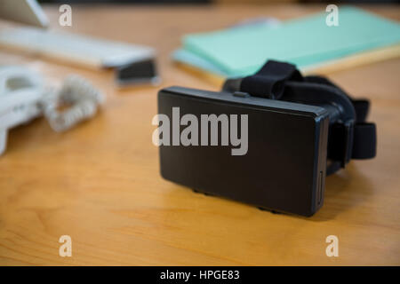 Close-up of virtual reality headset on desk in office Stock Photo