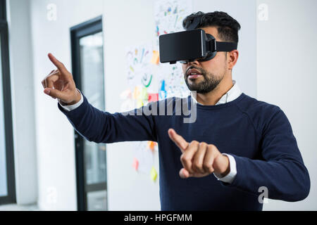 Graphic designer using the virtual reality headset in creative office Stock Photo