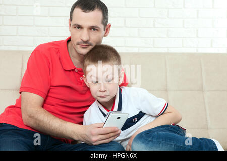 Happy father and son playing and laughing together at home. Family concept Stock Photo