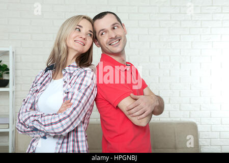 Man and woman standing back to back after quarrel at home. Conflicts in family people concept Stock Photo