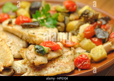 Cod fish with vegetables and potatoes Stock Photo