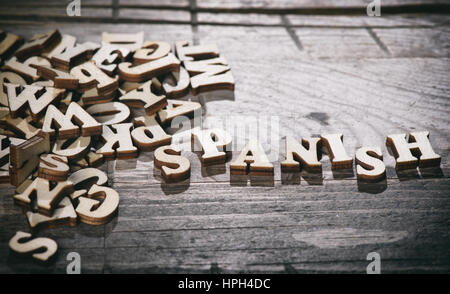 Word spanish made with wooden letters. Learning language concept Stock Photo
