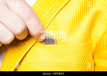 businessman puts the euro on the black hour Stock Photo