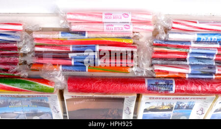 Colourful sticks of rock on sale in Brighton seaside resort gift shop UK Stock Photo