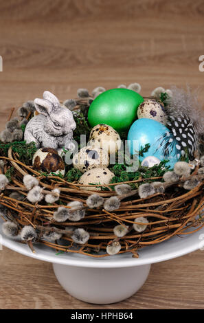 Easter colored eggs scattered on a green moss as an element of a holiday decoration ideas Stock Photo