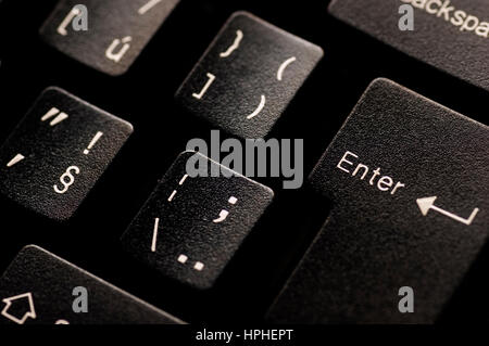 close up detail of a black computer keyboard and the Enter key Stock Photo