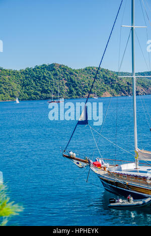 wooden blue cruise boat anchored in the bay Stock Photo