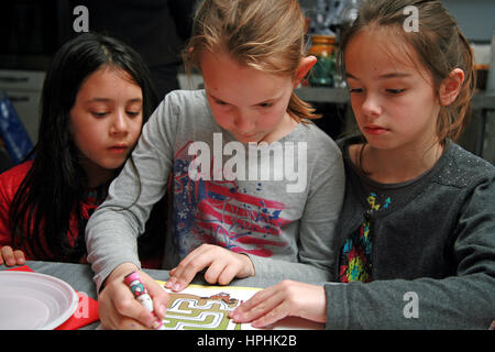 Girls colouring together Stock Photo