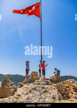turkish flag waving on the hilltop in blue bright sky, mavi gokyuzunden dalgalanan turk bayragi Stock Photo