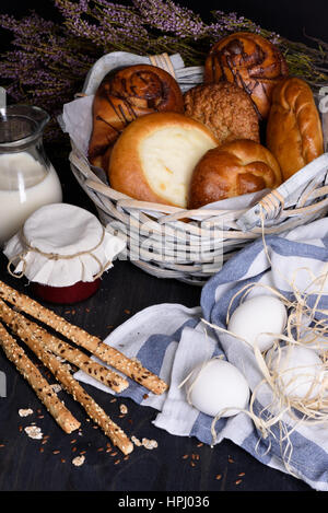 Bakery counter with variety of sweet pastry with cottage cheese, jam, milk and eggs. Stock Photo