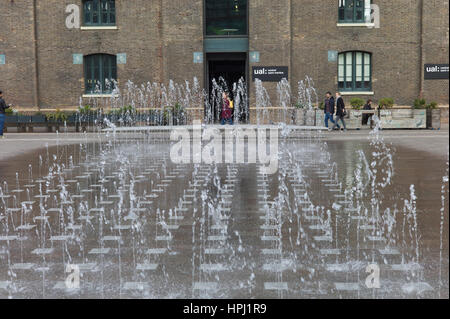 Water feature outside UAL Central St Martin's in Granary Basin, King's Cross, London Stock Photo