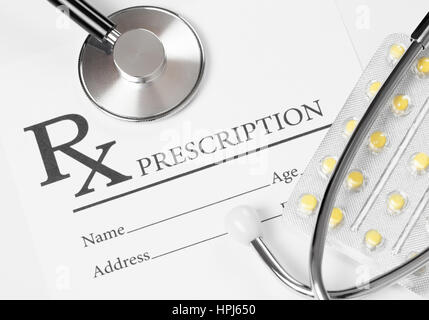 Medicine, healthcare and all things related - prescription form with stethoscope over it Stock Photo