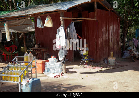 Preah Dak Village House with Boy in Siem Reap - Cambodia Stock Photo