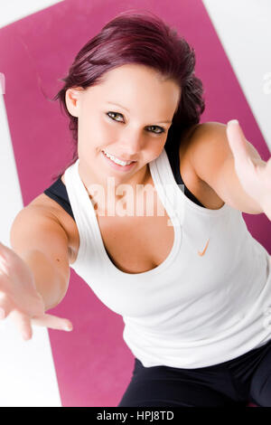 Model released , Sportliche, junge Frau auf Jogamatte - sporty, young woman on a yoga mat Stock Photo