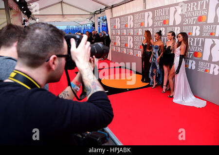 Little Mix's Perrie Edwards, Jesy Nelson, Leigh-Anne Pinnock and Jade Thirlwall attending the Brit Awards at the O2 Arena, London. Stock Photo