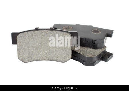 Brake pads isolated on white background. Car spare pars for brakes service. Stock Photo