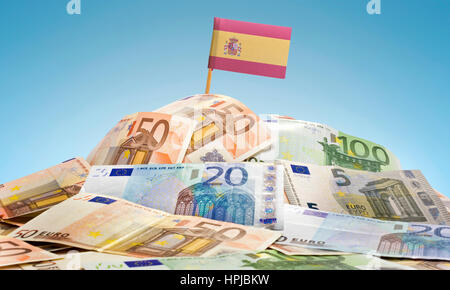 The national flag of Spain sticking in a pile of mixed european banknotes.(series) Stock Photo