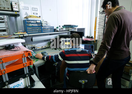 Rear view of two engineers working Stock Photo