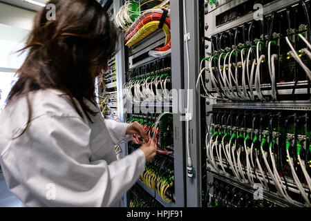 Data center technician working in the server room Stock Photo