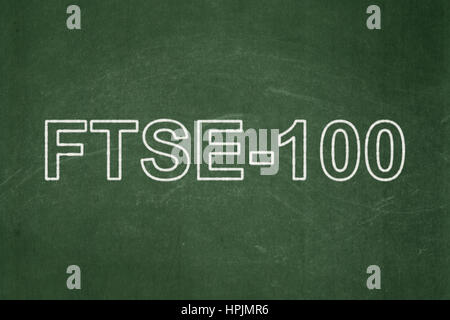 Stock market indexes concept: FTSE-100 on chalkboard background Stock Photo