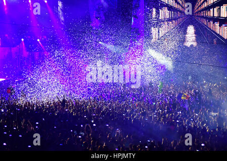 CLUJ-NAPOCA, ROMANIA - AUGUST 7, 2016: Confetti cannons throwing confetti from the stage over the crowd at a Dj Lost Frequency concert at the Untold F Stock Photo