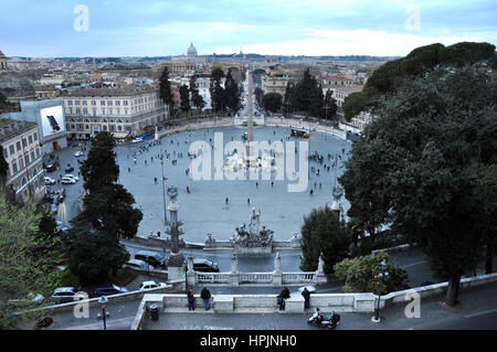 ROME, ITALY - MARCH 14, 2016: Tourists visiting the Piazza del Popolo in Rome, one of major squares of the city Stock Photo