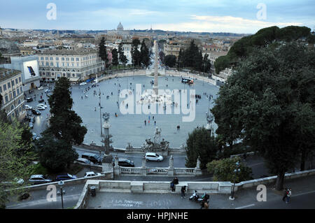 ROME, ITALY - MARCH 14, 2016: Tourists visiting the Piazza del Popolo in Rome, one of major squares of the city Stock Photo