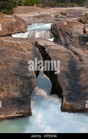 Natural Bridge spans the flow of the Kicking Horse River in the Yoho National Park, British Columbia, Canada Stock Photo