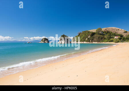 Kaiteriteri, Tasman, New Zealand. View across Tasman Bay from the sandy beach at Little Kaiteriteri, Torlesse Rock visible offshore. Stock Photo