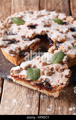 Delicious pie with plum jam closeup on the table. vertical Stock Photo