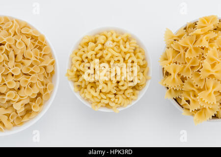 Raw italian macaroni in plates Stock Photo