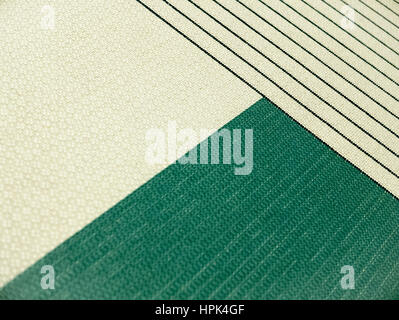 Geometric patterns in carpet. Triangles and oblique lines at the fabric. Stock Photo