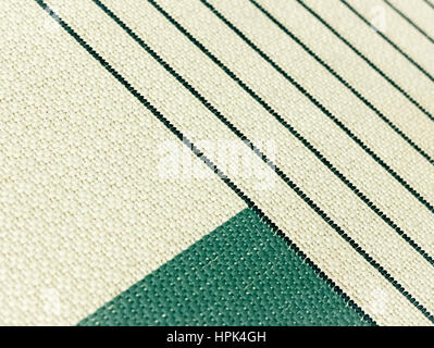 Geometric patterns in carpet. Triangles and oblique lines at the fabric. Stock Photo