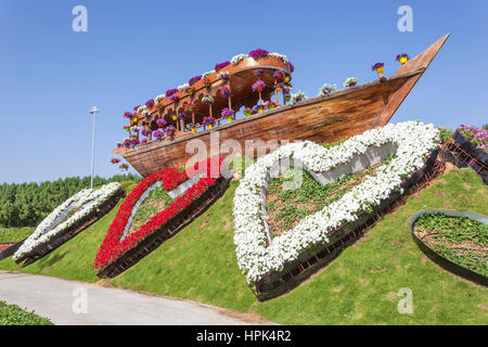 DUBAI, UAE - NOV 27, 2016: Historic dhow and flowers at the Miracle Garden in Dubai. United Arab Emirates, Middle East Stock Photo