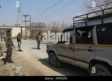 Srinagar, Kashmir. 23rd Feb, 2017. Indian policemen stop a passenger vehicle for checking after a militant attack on the outskirts of Srinagar, summer capital ofKashmir, Feb. 23, 2017. At least three Indian army troopers were killed and three others wounded on Thursday after militants ambushed them in restiveKashmir, officials said. One woman was also killed in the crossfire. Credit: Javed Dar/Xinhua/Alamy Live News Stock Photo