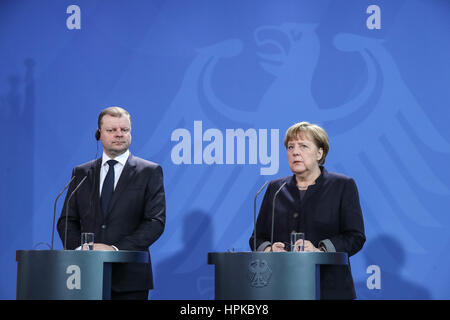 Berlin, Germany. 23rd Feb, 2017. German Chancellor Angela Merkel (R) and visiting Lithuanian Prime Minister Saulius Skvernelis attend a joint press conference in Berlin, capital of Germany, on Feb. 23, 2017. Credit: Shan Yuqi/Xinhua/Alamy Live News Stock Photo